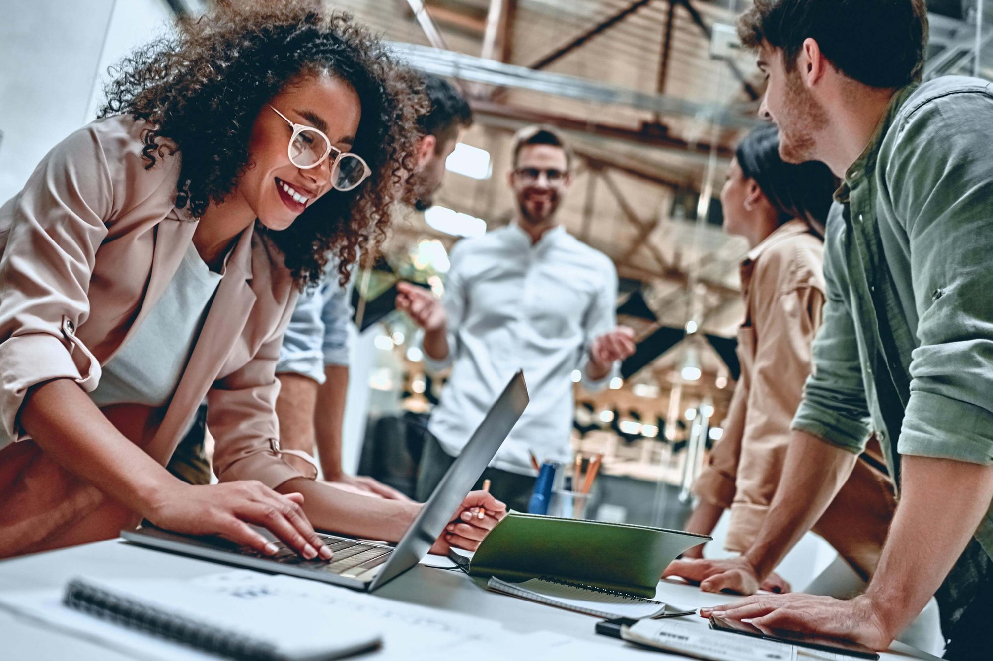 Employees working around a desk